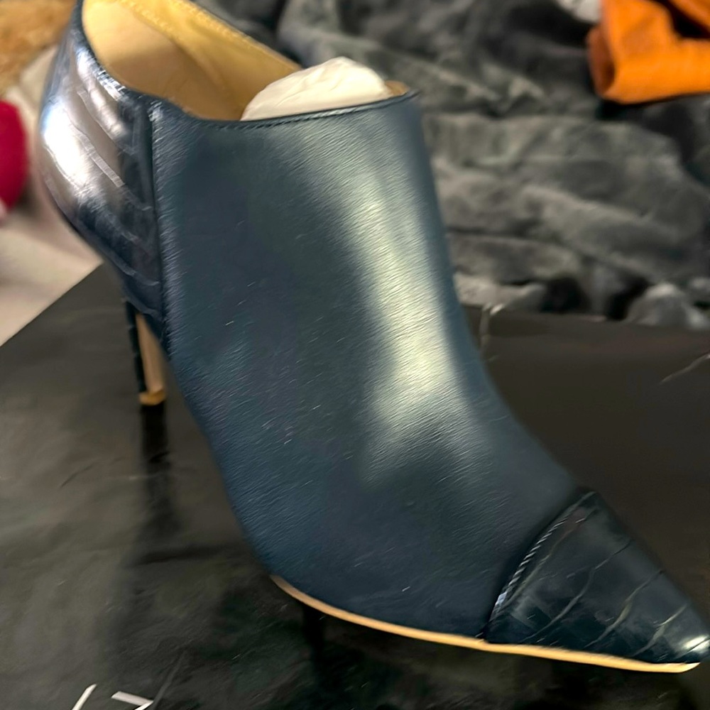 Brand new never wore dark navy low boot about 3 inches in heel. Still in box.